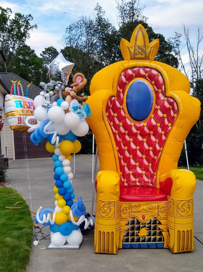 Giant throne chair and birthday balloon decorations setup for drive-by event in Cary NC