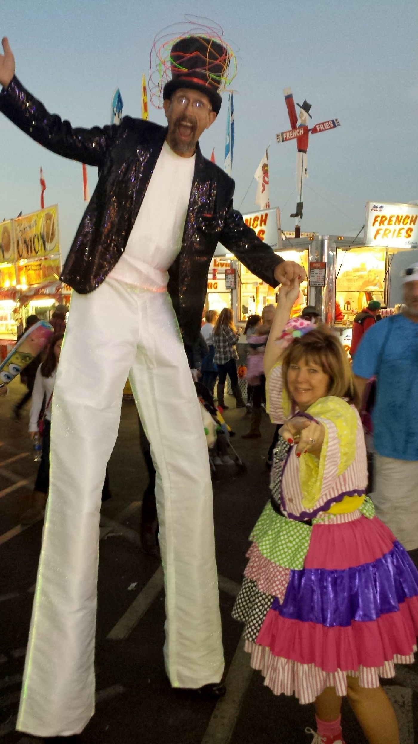 Zoe with a stilt walking friend at the NC State Fair