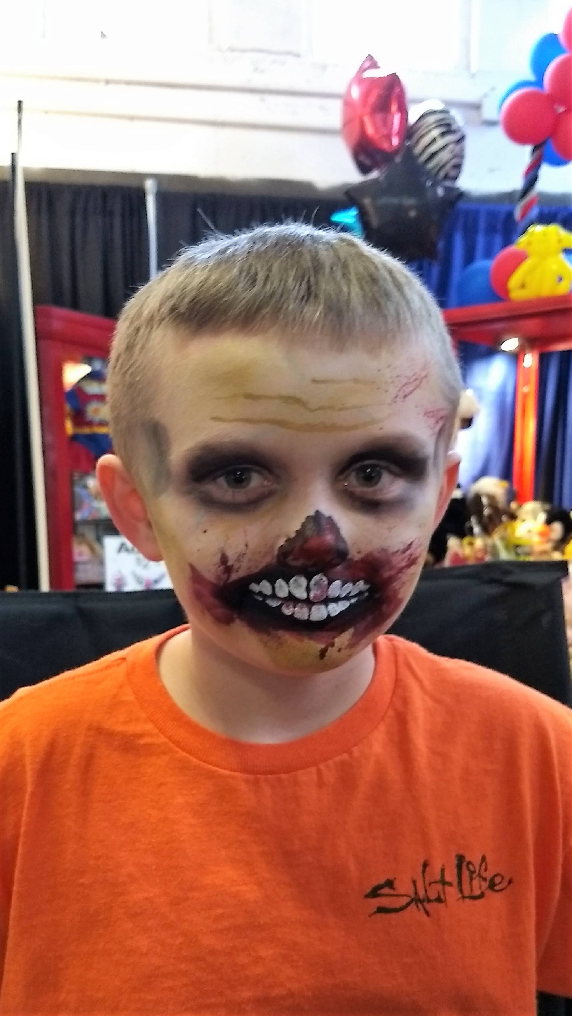 An awesome zombie walking dead face painting by Linda at the NC State Fair